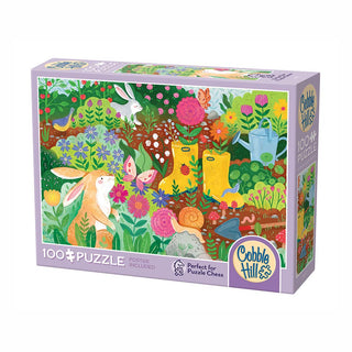 The Cobble Hill Rabbit Garden 100-piece jigsaw puzzle features large pieces and a vibrant garden scene with rabbits, flowers, snails, boots, and watering cans. Includes poster for reference.