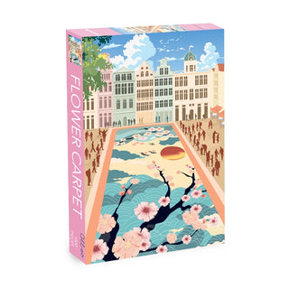 The Flower Carpet | 1,000 Piece Jigsaw Puzzle by Olleo Puzzles features a city square with classic buildings, people, and a floral-inspired carpet of cherry blossoms and waves, inspired by the Grand-Place Brussels display.
