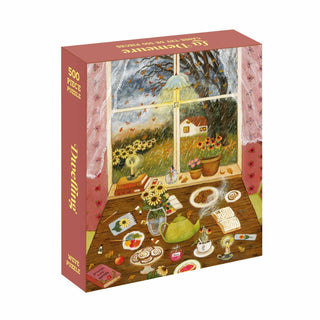 The WEVE Dwelling | 500 Piece Jigsaw Puzzle features a cozy indoor tea scene with rain, flowers, books, pastries, and a teapot. Made from premium blue board for durability and a velvet-soft touch.