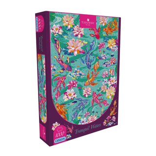 Gibsons Games presents the House of Turnowsky: Tranquil Waters 1,000 Piece Jigsaw Puzzle, featuring a peaceful koi pond scene with graceful koi fish and water lilies on a calming green-blue background.