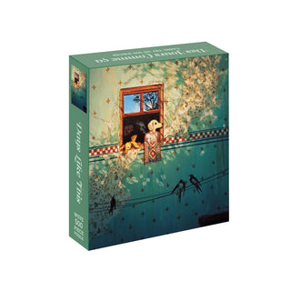 A Days Like This 500 Piece Jigsaw Puzzle box featuring a dog leaning out of a window with hanging rugs, vines, and birds perched on a wire below.