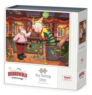Enjoy family fun this holiday with the Boardwalk Puzzle Company’s Toy Testing Dept. 500 Piece Jigsaw Puzzle, featuring a festive scene with a clown jack-in-the-box and bearded man surrounded by toys.