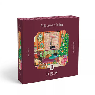 Experience holiday cheer with the Noël Au Coin Du Feu 500 Piece Jigsaw Puzzle by la pauz. This boxed Christmas puzzle features a charming illustration of a festive room adorned with a decorated tree, a glowing fireplace, and cozy pets resting by the fire—perfect for celebrating the season.