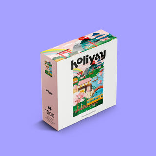 The Rêverie Japonaise 1,000 Piece Jigsaw Puzzle by Holiyay Puzzles features Laura Lhuillier’s colorful illustrations of Japanese landmarks on a premium matte box with a purple background.