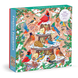 Galison’s Festive Feathers | 500 Piece Jigsaw Puzzle showcases Olga Akbarova’s colorful bird and winter decoration illustrations on a festive tiered tray.