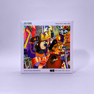 StoPuzzle’s New York | 500 Piece Jigsaw Puzzle features vibrant artwork by Polina Alekseenko, capturing Times Square with animated characters and lively billboards in a colorful illustrated scene.