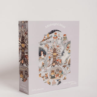The Midnight Mail | 500 Piece Jigsaw Puzzle by Once Upon A Puzzle features woodland animals gathered around a tree in a charming winter nighttime scene.
