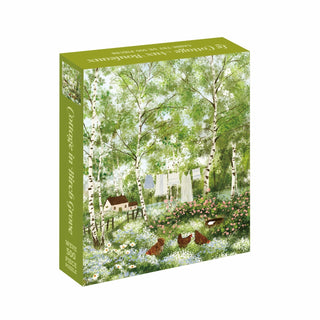 The WEVE Cottage in Birch Grove | 500 Piece Jigsaw Puzzle showcases a charming illustration of a birch grove complete with a cottage, chickens, blooming flowers, and laundry swaying on a clothesline. Made from recycled paper and finished with a velvet-soft touch coating, this puzzle combines eco-friendly materials with a luxurious tactile experience as you assemble it.