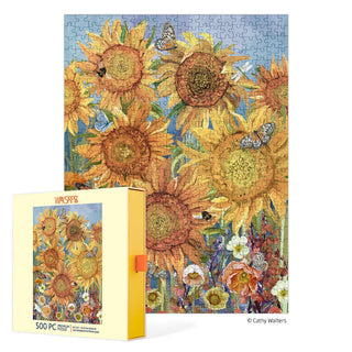 The WerkShoppe Sunflowers | 500 Piece Jigsaw Puzzle features vibrant sunflowers, butterflies, bees, and a blue sky; the box displays the same colorful sunflower artwork as the finished puzzle.