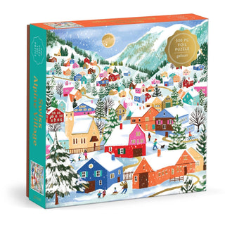 The Galison Swiss Alpine Village | 500 Piece Jigsaw Puzzle features a vibrant winter scene of a snow-covered alpine village, complete with people and trees, set against majestic snowy mountains, capturing the enchanting charm of Swiss winter landscapes.