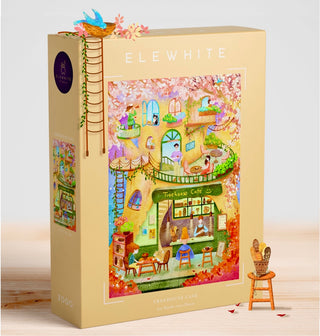 The "Treehouse Cafe" 1,000 piece jigsaw puzzle by Elewhite features original artwork of a whimsical café nestled in a treehouse, surrounded by vibrant foliage and playful characters.