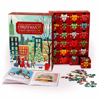 The Boardwalk Puzzle Company Christmas Holiday Traditions Puzzle Advent Calendar features 24 red drawers with puzzle pieces, a booklet, and festive cityscape art—perfect for a new Christmas countdown tradition!.