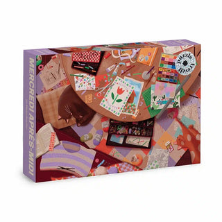 The Trevell “Mercredi Après-Midi” 1,000-piece puzzle features Marion Brouillon’s artwork: a cozy scene of a cat, craft supplies, and colorful objects—perfect for creative afternoons.