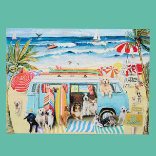 Doggie Surf School by WerkShoppe is a 1,000 piece jigsaw puzzle featuring dogs around a blue van on the beach with surfboards, palm trees, umbrellas, and sailboats—ideal for beach or dog puzzle fans.