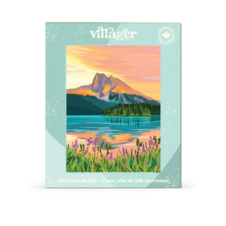 A 500-piece Villager Puzzles box titled “Yoho National Park” displays a painted lake scene at sunset—featuring mountains, trees, flowers, and a canoe—making it perfect for fans of serene landscapes such as those found in Emerald Lake or Yoho National Park.