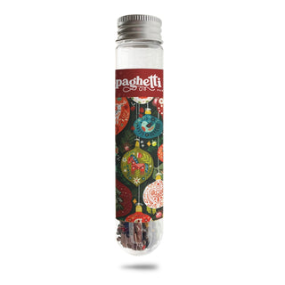 Introducing the Yuletide Gleam | 150 Piece Jigsaw Puzzle by Spaghetti Tree—a clear test tube with a metal cap, adorned with festive holiday ornament designs and a spaghetti-themed label. Inside, you’ll find a mini puzzle of 150 pieces cleverly shaped like spaghetti noodles, offering a fun and portable puzzling experience.