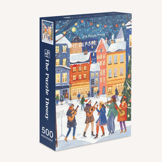A Night Before Christmas 500 Piece Jigsaw Puzzle box featuring a Caroline Bonne Müller illustration of people playing music in a snowy, decorated Christmas town square at night.