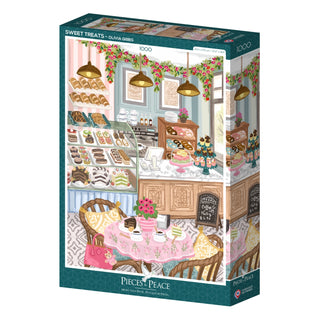 The Sweet Treats 1,000 Piece Jigsaw Puzzle by Pieces & Peace features Olivia Gibbs’ bakery interior illustration with pastry display cases, a decorated table, and floral garlands. Made in France.