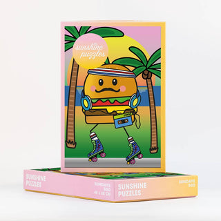 Get ready for a fun, eco-friendly challenge with the Sundays | 500 Piece Jigsaw Puzzle from Sunshine Puzzles! This illustrated puzzle box stars Mister Burgerman—a roller-skating burger wearing a headband and headphones and holding a boombox—set amid a vibrant tropical beach scene with palm trees. Made from recycled waste paper, this quirky jigsaw is perfect for fans of playful designs and sustainable puzzles.