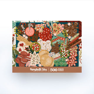 The Spaghetti Tree "Christmas Cookies" 500-piece jigsaw puzzle features a vibrant illustration of assorted Christmas cookies, candies, and festive treats on the box.
