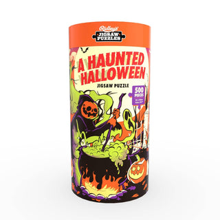 Cylindrical container of Galison’s A Haunted Halloween 500-piece jigsaw puzzle, featuring cartoon spooky characters around a cauldron on the label.