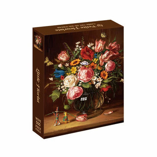 Little Florist 500 Piece Jigsaw Puzzle box showing an oil painting of a flower bouquet in a glass vase and two small wooden figures on a table.