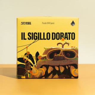 A yellow box labeled Il Sigillo Dorato by StoPuzzle holds a 1,000-piece jigsaw puzzle with a jungle scene featuring an illustrated, plant-covered stone face.