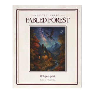 Fabled Forest 1,000 Piece Jigsaw Puzzle box featuring a dragon flying over a cabin in a forest under a starry sky.