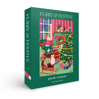 The Puzzle Weekend Furry & Festive | 1,000 Piece Jigsaw Puzzle features a cozy living room with pets, a decorated Christmas tree, and presents—an ideal holiday puzzle for pet lovers.