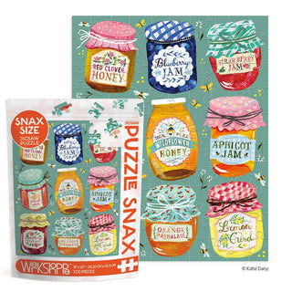 The WerkShoppe Jam & Honey 100 Piece Jigsaw Puzzle features illustrated jars of jam and honey on a teal background—a fun, skill-building puzzle for kids.