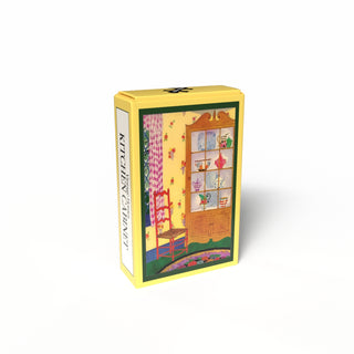 A yellow rectangular box features a vintage illustration of a red chair and dish-filled kitchen cabinet against a floral yellow wall. "Kitchen Cabinet | 99 Piece Jigsaw Puzzle" by Penny Puzzle is written on the side.