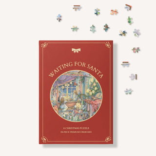 A red box labeled "Waiting For Santa | 896 Piece Jigsaw Puzzle" by The Puzzle Theory features Kim Jacobs’ illustration of children by a window, with festive jigsaw pieces scattered on the right.