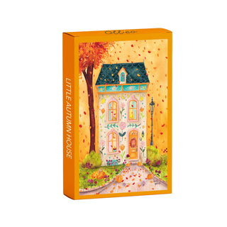 Olleo Puzzles’ Little Autumn House | 99 Piece Jigsaw Puzzle arrives in a box featuring an illustrated, decorated house set in autumn with an orange border and the title LITTLE AUTUMN HOUSE on the side—ideal for fans of fairytale landscapes or anyone looking for a charming, cozy puzzle experience.