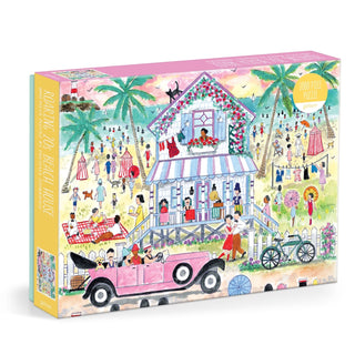 The Galison Michael Storrings Roaring 20s Beach House 1,000-piece puzzle showcases a vibrant beach scene with a stilt house, vintage car, palm trees, and people enjoying the lively atmosphere.