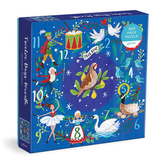 The 12 Days Wreath 500 Piece Jigsaw Puzzle by Galison features festive illustrations inspired by the Twelve Days of Christmas on a blue background.