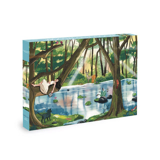 Experience Olleo Puzzles' “Woodland Wisdom” 500 piece jigsaw puzzle: an enchanting scene of a girl in a white dress resting on a tree branch by a pond, surrounded by deer, panther, frog, squirrel, and birds—perfect for relaxation or gift-giving.