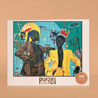 When I Meet J.M.B. 500-piece jigsaw puzzle featuring a vibrant, graffiti-style painting of two Black women in stylish suits, adorned with crowns and text such as Black Queen and King.