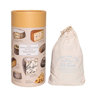 Cheese | 500 Piece Jigsaw Puzzle by 123 Farm features tempting cheese images in a cylindrical box with a drawstring bag—perfect for cheese lovers and puzzle fans alike.