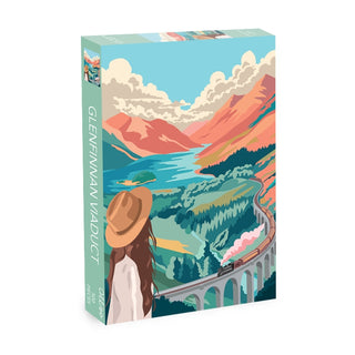 Experience the serene beauty and iconic scenery of Scotland with the Glenfinnan Viaduct | 500 Piece Jigsaw Puzzle by Olleo Puzzles. This illustrated puzzle depicts a woman in a hat admiring a breathtaking landscape, featuring the famous viaduct, a valley, winding river, and a train crossing beneath partly cloudy skies—perfect for lovers of the Scottish Highlands.