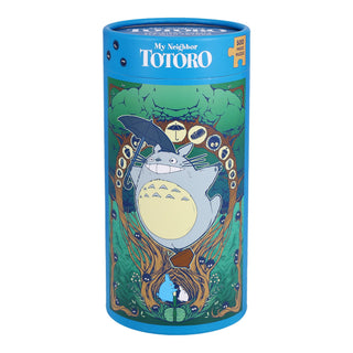 The Studio Ghibli My Neighbor Totoro | 500 Piece Jigsaw Puzzle by Chronicle Books comes in a cylindrical box featuring Totoro with an umbrella and a forest background.