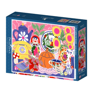 The L'étagère de Mamie 500-piece puzzle by Pieces & Peace features Marie Boiseau’s colorful table scene with flowers, a teapot, fruit, and matryoshka dolls—beautifully made in France.