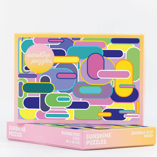 The Bubble Pop | 1,000 Piece Jigsaw Puzzle by Sunshine Puzzles features an abstract, colorful geometric design with overlapping shapes in yellow, blue, green, pink, and purple. Crafted from recycled waste paper for an eco-friendly experience, this vibrant graphic puzzle is perfect for any puzzler.