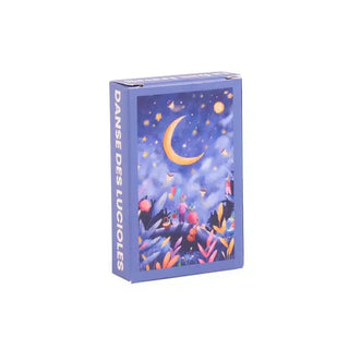 The Trevell Danse Des Lucioles | 99 Piece Jigsaw Puzzle features colorful plants, a crescent moon, and glowing fireflies on a starry night—perfect for mini puzzle fans or anyone seeking a charming challenge.