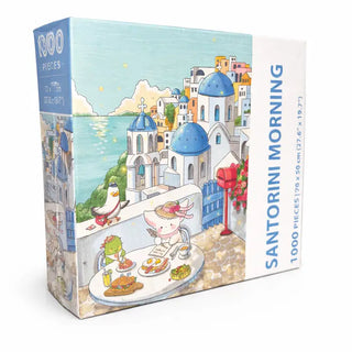 Arcadia Puzzles' Santorini Morning | 1,000 Piece Jigsaw Puzzle features cartoon animals having breakfast on a balcony overlooking blue-domed buildings and the sea, all in sustainable packaging.