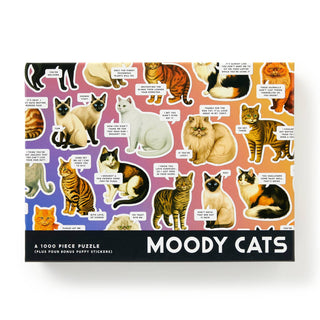 The Galison Moody Cats | 1,000 Piece Jigsaw Puzzle features a vibrant cat collage with various breeds and funny speech bubbles on a colorful gradient background.