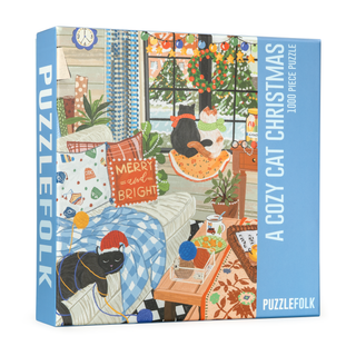 Puzzlefolk’s "A Cozy Cat Christmas" 1,000 piece jigsaw puzzle features a festive indoor scene with cats, holiday décor, and a “Merry and Bright” pillow—an ideal holiday gift for cat lovers.