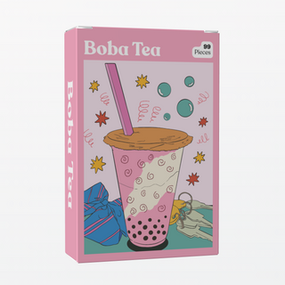 The Puzzledly Boba Tea | 99 Piece Jigsaw Puzzle comes in a pink box and features a cute boba tea illustration with colorful doodles, making it perfectly pocket-sized for fun on the go.