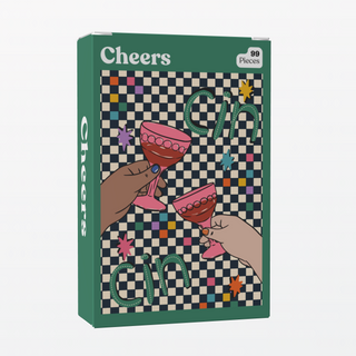 Puzzledly's Cheers | 99 Piece Jigsaw Puzzle features illustrated hands clinking pink glasses on a checkered background with colorful squares, stars, ribbon-cut pieces, and the word "Cin" repeated throughout.