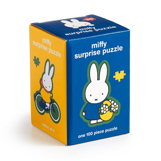 A blue and yellow box labeled "Miffy Surprise Puzzle" by Galison featuring the Miffy rabbit, containing one 100-piece jigsaw puzzle inside.