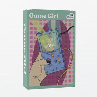 The Game Girl | 99 Piece Jigsaw Puzzle by Puzzledly features a hand holding a blue handheld console with "START GAME" on the screen—perfect for pocket-sized fun.